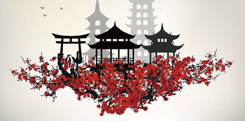Una pagoda asiática y un árbol con flores rojas